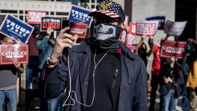 Donald Trump supporters protest outside the Philadelphia Convention center as votes continue to be counted. Picture: AFP.