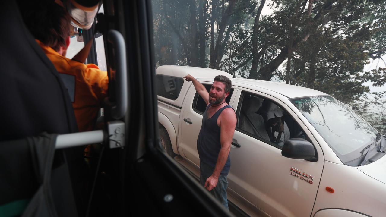 A local talks to RFS. Picture: Gary Ramage