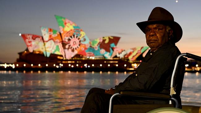 Pitjantjatjara artist David Miller in front of his Goanna Songline artwork projected on to the Sydney Opera House. Picture: Jeremy Piper