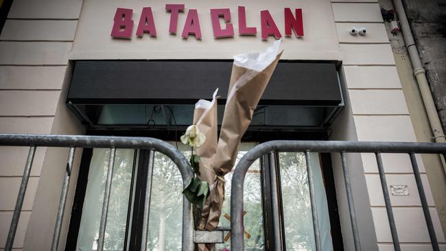 Flowers tied to the fence outside of the renovated theatre Bataclan which will reopen on November 12.