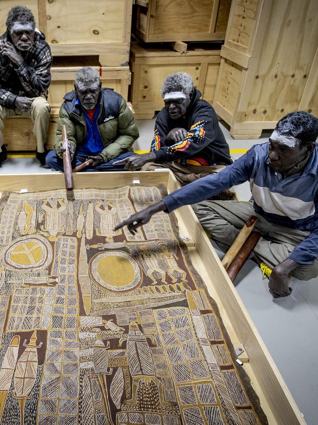 Djimbala Ngurruwuthun, Bingurr Wirrpanda, Waka Mununggurr and Bandarr Wirrpanda sing to Yolngu artworks set to depart to the US. Picture: Arsineh Houspian