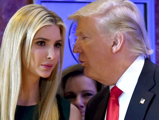 (FILES) This file photo taken on January 11, 2017 shows US President-elect Donald Trump as he whispers to his daughter Ivanka during a press conference at Trump Tower in New York.  Donald Trump's daughter Ivanka, an unpaid White House adviser to the American president, says she has her father's ear and can disagree with him with "total candor." In an interview broadcast April 5, 2017 on "CBS This Morning," Ivanka Trump said she will continue the advocacy work she was doing in the private sector, which includes pushing for the economic empowerment of women and on issues involving education."I'm still my father's daughter," she told CBS. "But I'll weigh in with my father on the issues I feel strongly about." / AFP PHOTO / TIMOTHY A. CLARY