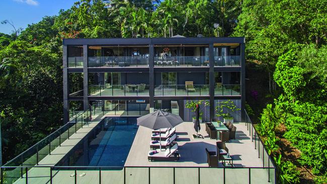 Mostyn’s Glass House epitomises tropical living with multiple decks, swathes of glass, a pool and an outdoor kitchen on 1897sq m of grounds.