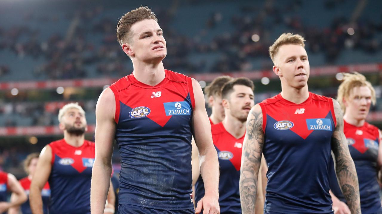 Bayley Fritsch and James Harmes walk off the MCG after Friday night’s loss. Picture: Michael Willson/AFL Photos