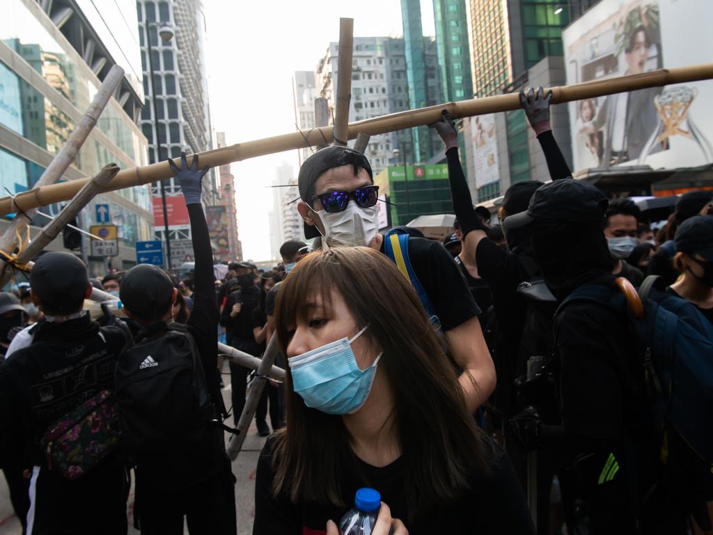 Demonstrators march on a street as they take part in a rally at Tsim Sha Tsui district in Hong Kong, China. Picture: Getty Images