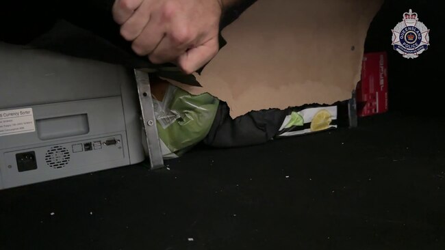 Police allegedly also found a cash counter and drugs in the compartment. Picture: QPS