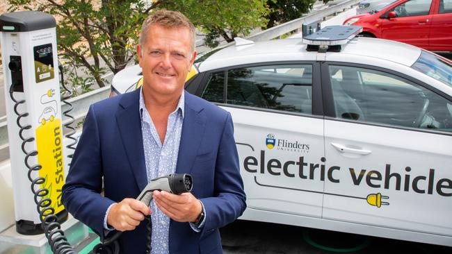 Flinders University vice-chancellor Colin Stirling at a charging point for electric vehicles.