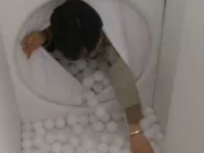 So crawling through a tunnel with small white balls must feel like being born right? Picture: RT