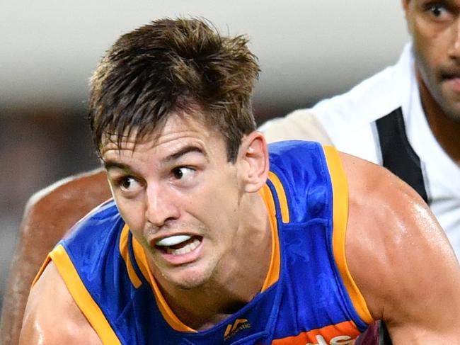 Jarryd Lyons (left) of the Lions in action during the Round 5 AFL match between the Brisbane Lions and the Collingwood Magpies at the Gabba in Brisbane, Thursday, April 18, 2019. (AAP Image/Darren England) NO ARCHIVING, EDITORIAL USE ONLY