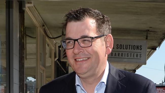 Victorian Premier Daniel Andrews with a Labor volunteer from the Northcote campaign during the State by-election for the Northcote District in Melbourne, Saturday November 18, 2017. (AAP Image/Mal Fairclough) NO ARCHIVING