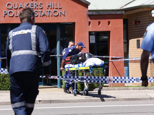 Paramedics outside Quakers Hill Police Station after the shooting. Picture: Peter Kelly