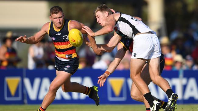 Rory Laird competes with Port Adelaide forward Todd Marshall at Port Pirie. Picture: Mark Brake/Getty Images