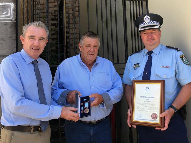 BRAVEHEART: Kevin Dowd's selfless act in rescuing a burning man from his car shortly before it exploded was recognised with a a Royal Humane Society of NSW Bronze Medal Bravery Award presented by Federal Member for Page Kevin Hogan. Richmond Police District Commander Superintendent Scott Tanner also presented Mr Dowd with a commendation. Photo: Alison Paterson