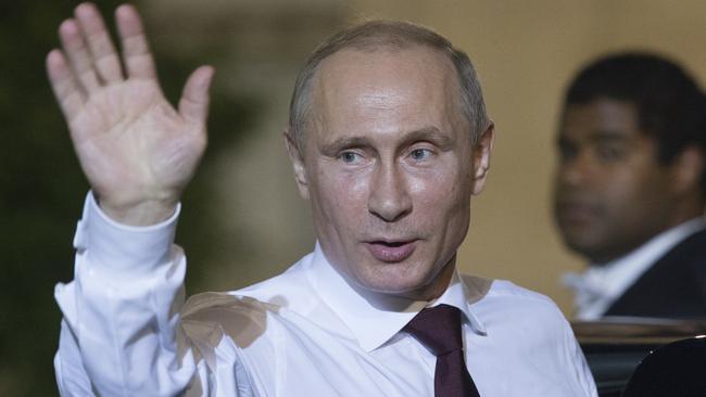Russian President Vladimir Putin leaves the Elysee Palace in Paris after meeting French President Francois Hollande.