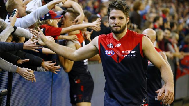Jesse Hogan celebrates the Anzac Day eve win over Richmond with Melbourne fans. Picture: Wayne Ludbey