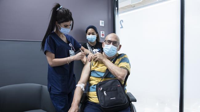 Cancer survivor Yoel Mor receives his third dose of the Pfizer vaccine at Sheba Medical Centre in Ramat Gan, Israel, on July 14. Picture: Getty Images