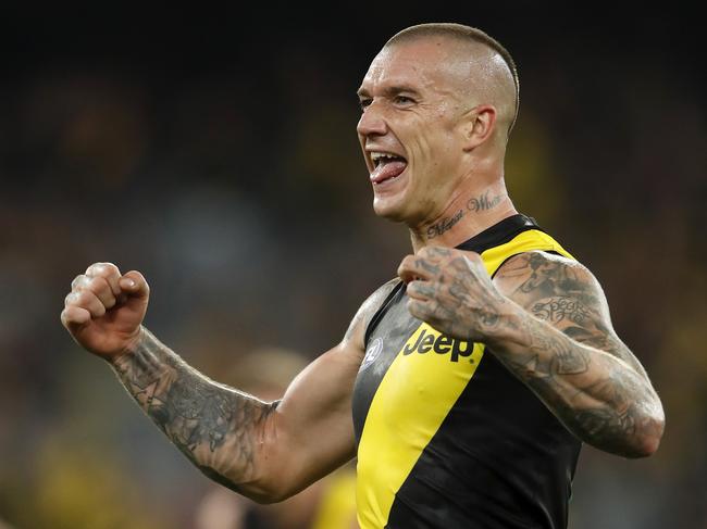 MELBOURNE, AUSTRALIA - MARCH 18: Dustin Martin of the Tigers and Dion Prestia of the Tigers react after Jack Riewoldt of the Tigers (not pictured) kicks a goal during the 2021 AFL Round 01 match between the Richmond Tigers and the Carlton Blues at the Melbourne Cricket Ground on March 18, 2021 in Melbourne, Australia. (Photo by Dylan Burns/AFL Photos via Getty Images)