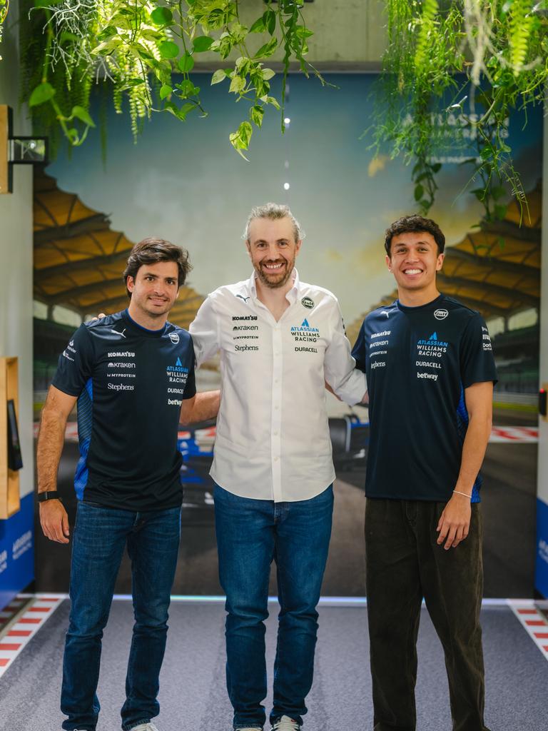 Atlassian boss, Mike Cannon-Brookes (centre) with Williams Formula One Drivers, Carlos Sainz (left) and Alexander Albon in Sydney.