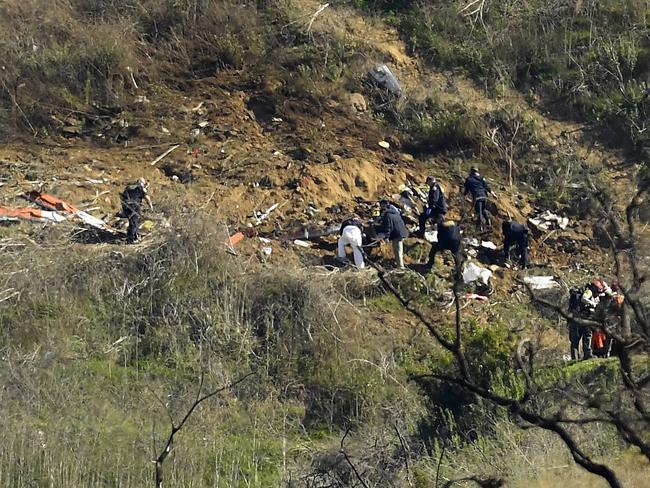 Investigators work the scene of a helicopter crash that killed former NBA basketball player Kobe Bryant. Picture: AP