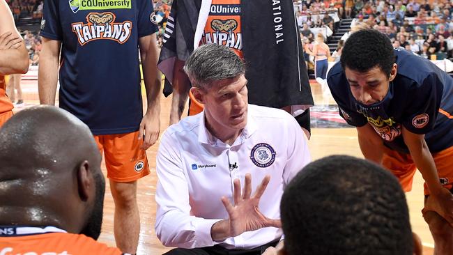 CAIRNS, AUSTRALIA — JANUARY 21: Coach Mike Kelly of the Taipans talks to his players at the quarter time break during the round 14 NBL match between the Cairns Taipans and the New Zealand Breakers at the Cairns Convention Centre on January 21, 2019 in Cairns, Australia. (Photo by Bradley Kanaris/Getty Images)