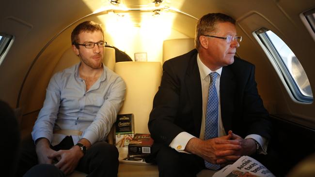 Denis Napthine, flying with his son Tom, looks out of the window of a chartered jet over Victoria for the last time as Premier on his way to Warrnambool on election day 2014. Picture: David Caird