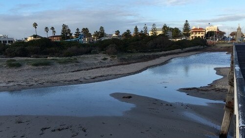 Water pooling around the Largs Bay jetty after sand was removed and carted to Semaphore South. Picture: Supplied