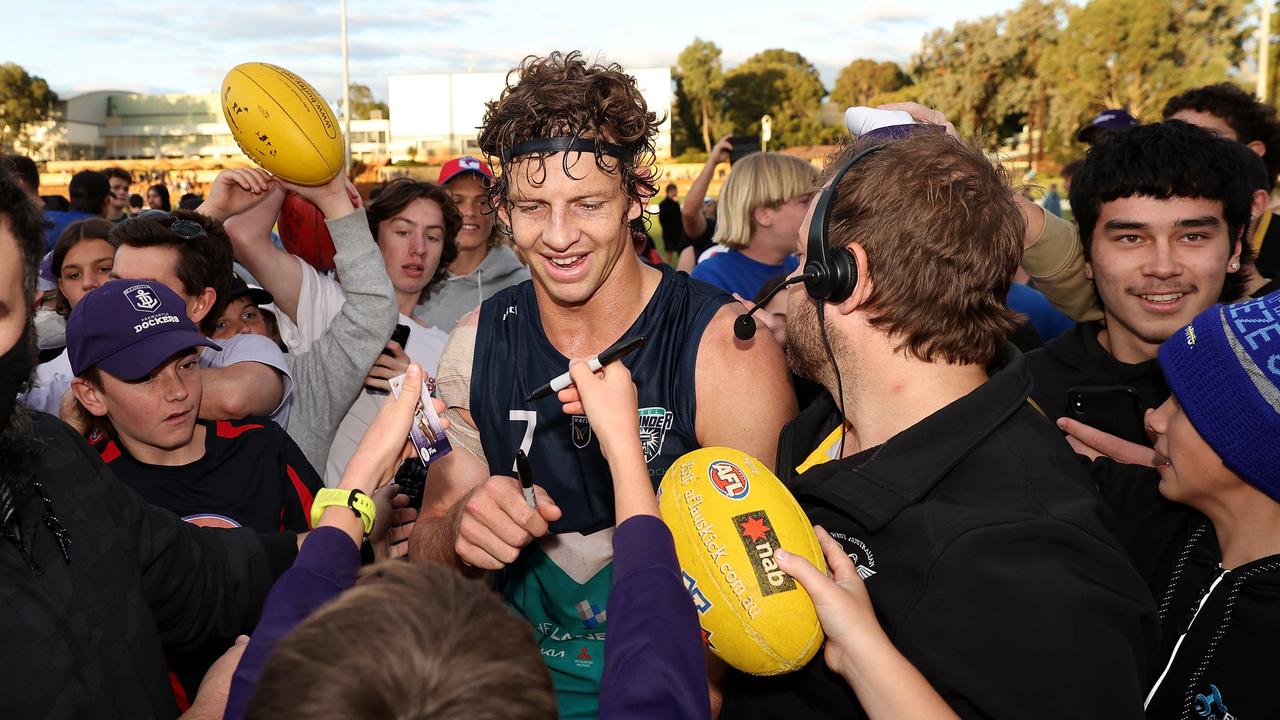 Fyfe poses for selfies and signs autographs after winning. (Photo by Paul Kane/Getty Images)