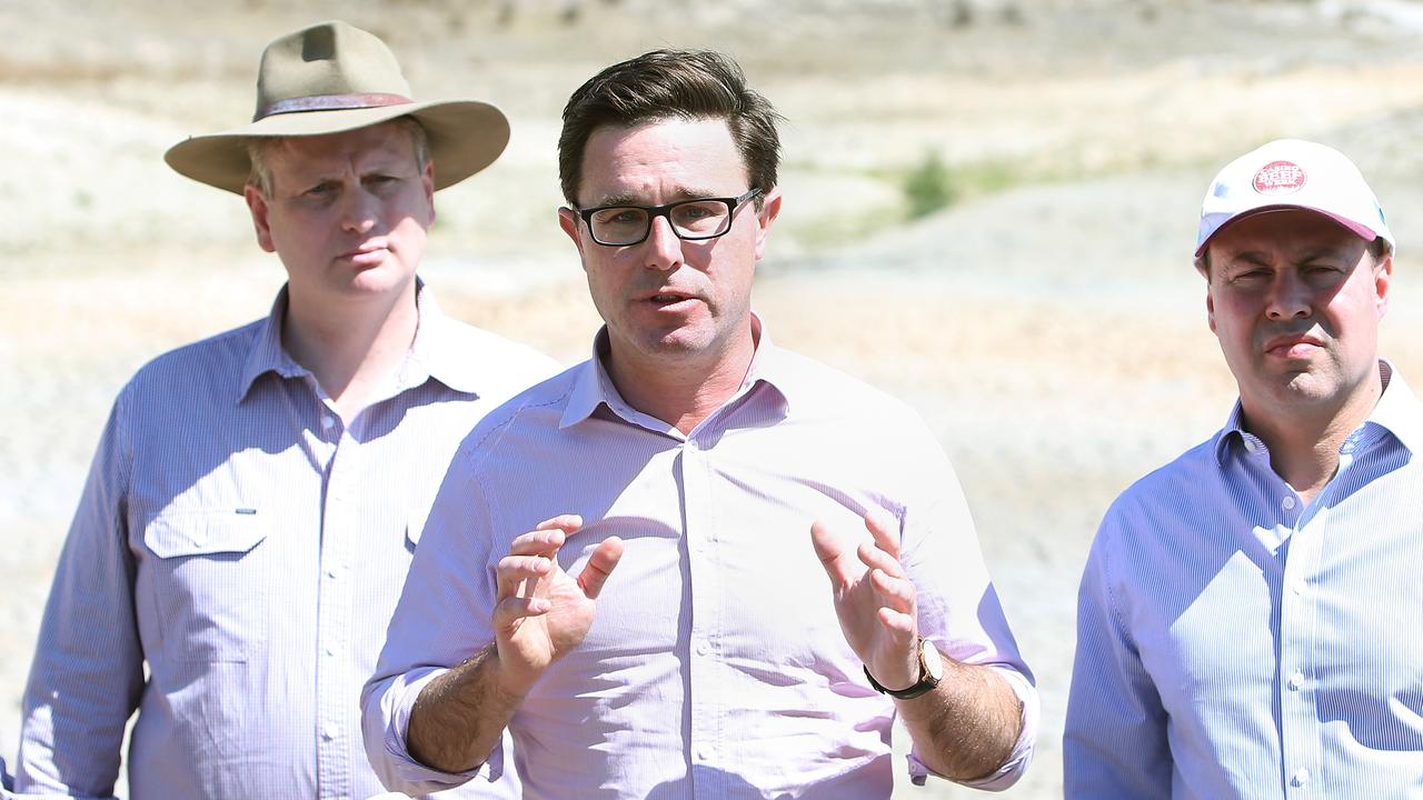 Minister for Drought and Water Resources David Littleproud in Cottonvale, Qld, with Treasurer Josh Frydenberg (right). Picture: Kym Smith