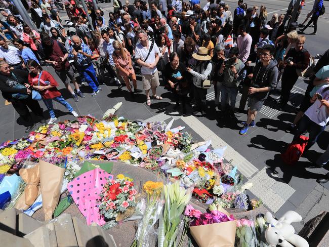 Mourners show up in their dozens to pay their respects. Picture: Alex Coppel.