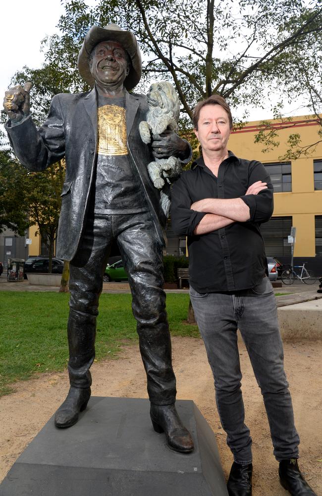 Jolly with a statue of Molly Meldrum in Richmond. Picture: Andrew Henshaw