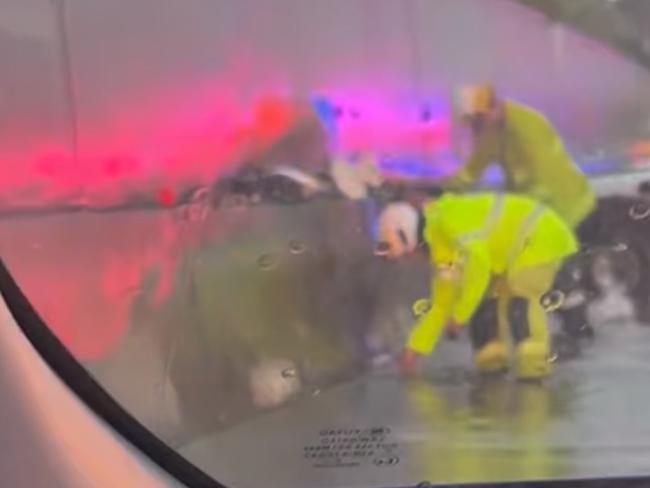 Emergency crews work to clear blocked drains after a multi-vehicle crash on the Townsville Ring Road. Picture: Facebook/Tariro Muzari