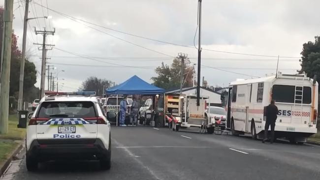 Tasmania Police crime scene investigators and officers on Main Street in Ulverstone where a woman was found dead. Photo: Helen Kempton