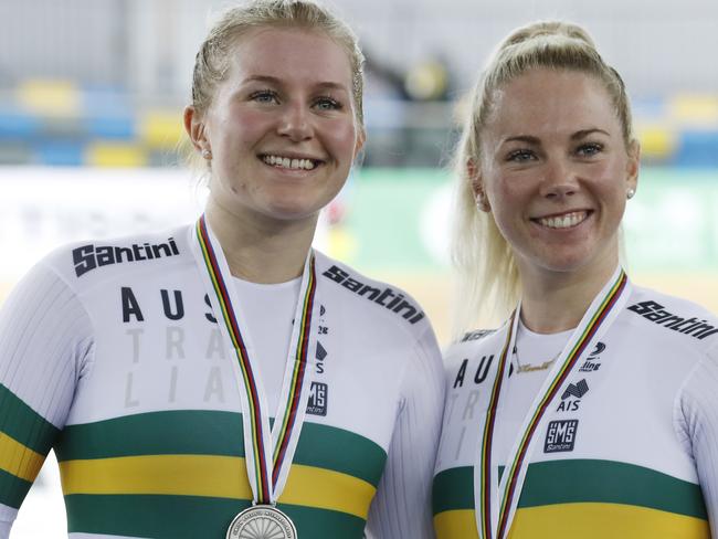 Australia's Stephanie Morton, left, and Kaarle Mcculloch celebrate on the podium after winning the silver medal in the Women's Team Sprint at the World Track Cycling championships in Hong Kong, Wednesday, April 12, 2017. (AP Photo/Kin Cheung)
