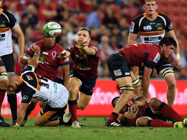 James Tuttle of the Reds (centre) releases the ball during the Round 3 Super Rugby match between the Queensland Reds and the Brumbies at Suncorp Stadium in Brisbane, Friday, March 2, 2018. (AAP Image/Dan Peled) NO ARCHIVING, EDITORIAL USE ONLY