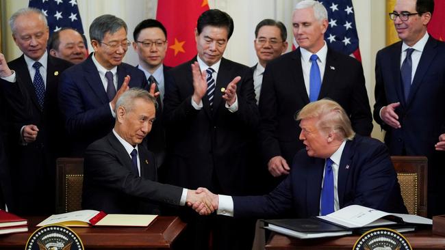 Chinese Vice-Premier Liu He and US President Donald Trump shake hands after signing ‘phase one’ of the US-China trade agreement in Washington on Thursday. Picture: Reuters