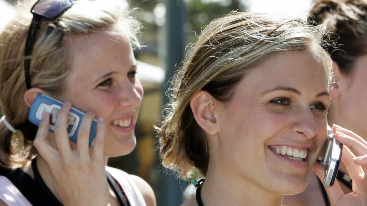 24/11/2004 PIRATE: (L-r) Georgia Orreal with Catherine Beer, Karleigh Elford and Kate Crowley talking on mobile phone in Surfers Paradise during Gold Coast Schoolies Week 24 Nov 2004. girls teenagers students phones