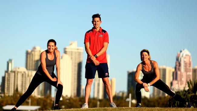 Personal Trainer Jack Smith from Vision Personal Training Southport trains (L-R) Sarah Willems and Jackie Scotchmer in the Broadwater Parklands. Photo: Kit Wise