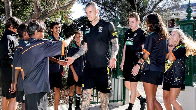 Dusint Martin meets with children at Lockington boarding house in Richmond. Picture: Tim Carrafa