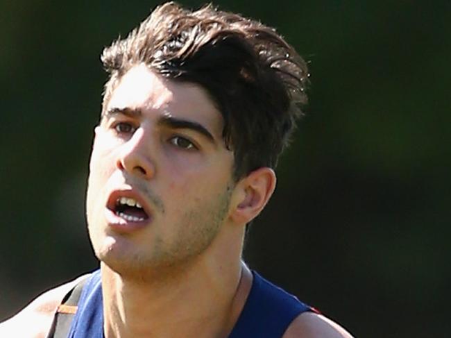 MELBOURNE, AUSTRALIA - DECEMBER 18: Christian Petracca of the Demons handballs during a Melbourne Demons AFL pre-season training session at Gosch's Paddock on December 18, 2015 in Melbourne, Australia. (Photo by Quinn Rooney/Getty Images)