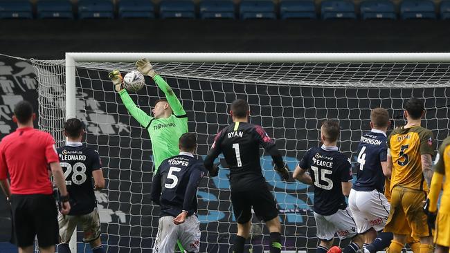 Millwall's English goalkeeper David Martin cannot prevent Solly March’s kick from levelling the score. Picture: Daniel Leal-Olivas/AFP