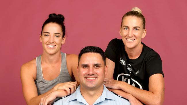 Senior Constable Ben Bjarnesen (centre) with Jacqui Bell, left, and Ali Brigginshaw. Picture: Steve Pohlner