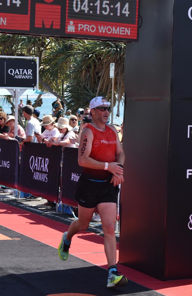 Athletes crossing the finish line at the Sunshine Coast Ironman 70.3 2023.