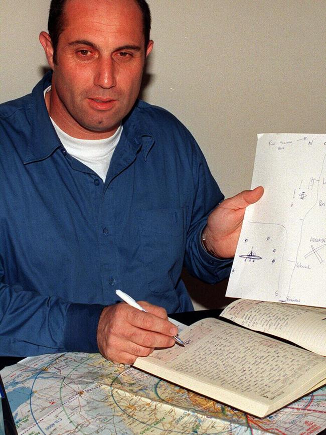 SA pilot Mark Muscat in 1998 with a diagram and report he made after his sighting.