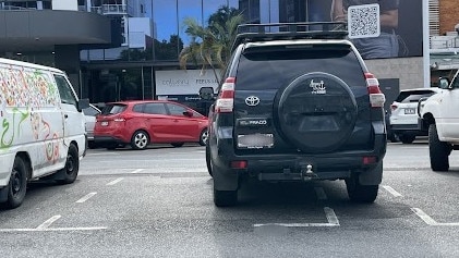 The generously sized car spaces on Grafton St, combined with gaps between spaces, often encourages sloppy parking by drivers. Photo: Isaac McCarthy.