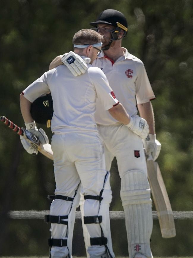 Aaron Ayre is congratulated by Justin Galeotti after reaching 100. Picture: Valeriu Campan