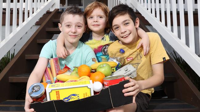 Pictured at their home in Penrith with a delivered food hamper is Levi Legg, Ari Legg and Brodie Legg. Picture: Richard Dobson