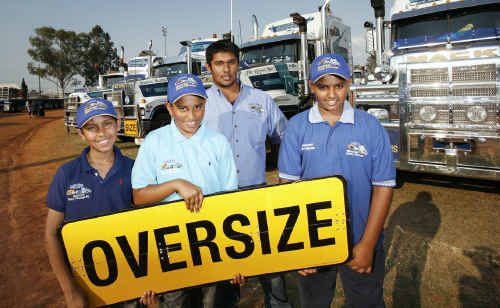 With their family trucking company’s Mactrans trucks are (from left) Huzaifah Ali, Farhan Deen, Ifran (rear) and Faadhil Deen, all of Forest Lake.