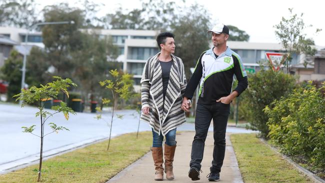 The Robertsons treading what used to be a Kellyville footpath. Picture: AAP IMAGE / Angelo Velardo