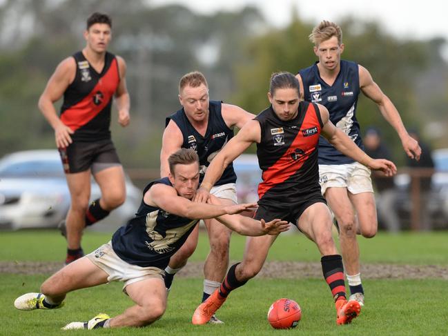 Mornington Peninsula FNL : Frankston Bombers v Edithvale-Aspendale at Baxter Park. The Bombers led at the last change but the Eagles finished strongly to win.  Edithvale-Aspendale playersd #1 Sam Monaghan and #5 Matthew Clarke contest with Frankston Bombers #2 Dale Sutton. Picture: AAP/ Chris Eastman