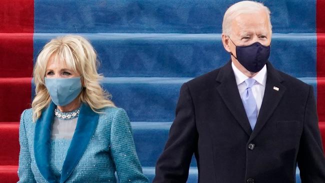 US President-elect Joe Biden flanked by wife Dr. Jill Biden arriving for his inauguration as the 46th US President on January 20, 2021, at the US Capitol in Washington, DC. (Photo by Patrick Semansky / AFP)